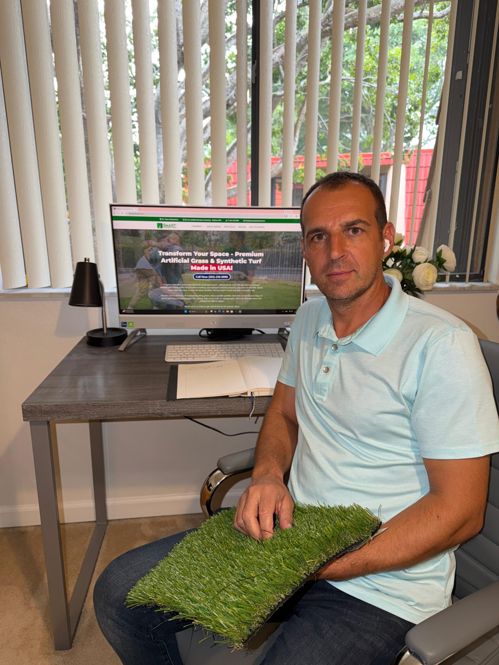 Catalin Chiticaru, founder of Smart Synthetic Turf, on an artificial grass install in Florida